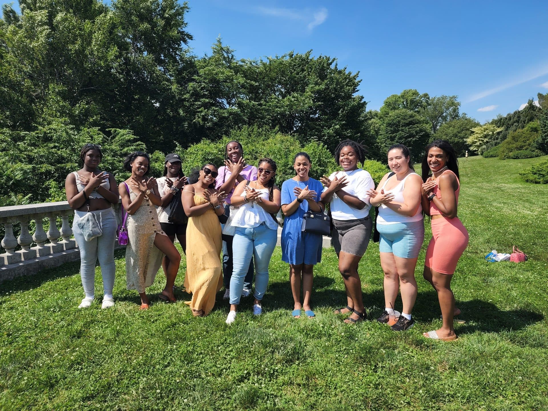 A group of GMG members posing together outdoors.