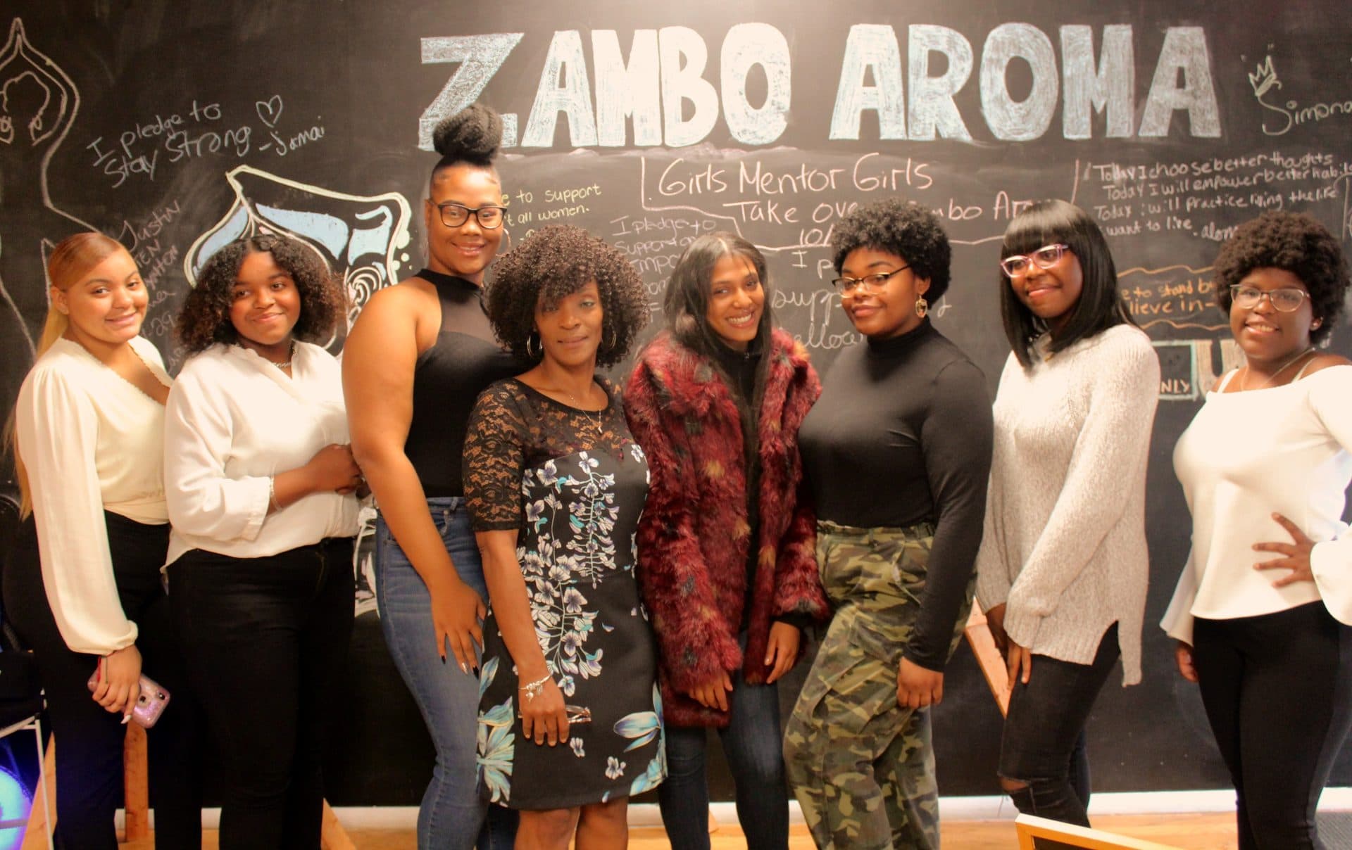 A group of women and girls posed together at a partner event.